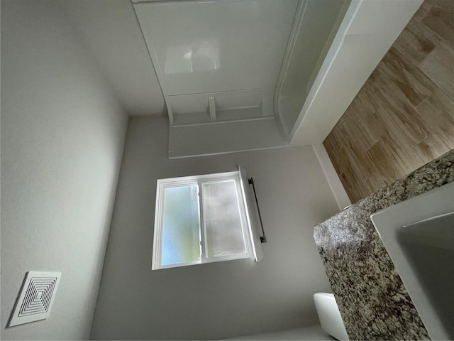 bathroom with sink and hardwood / wood-style floors