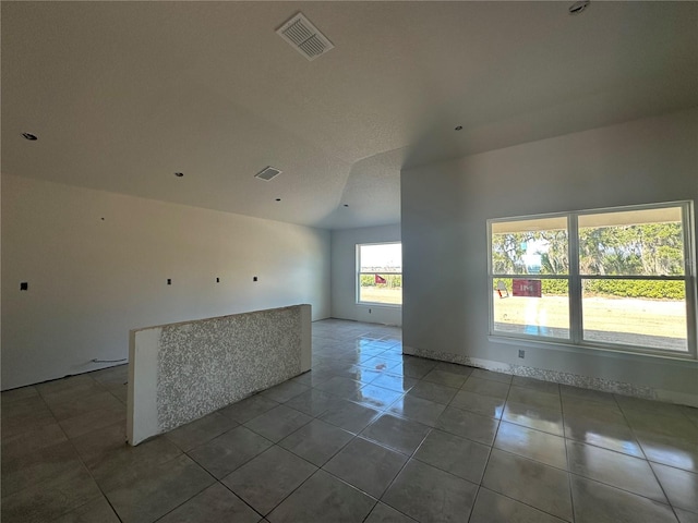 spare room featuring tile patterned flooring