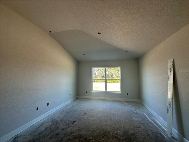 unfurnished room featuring a textured ceiling