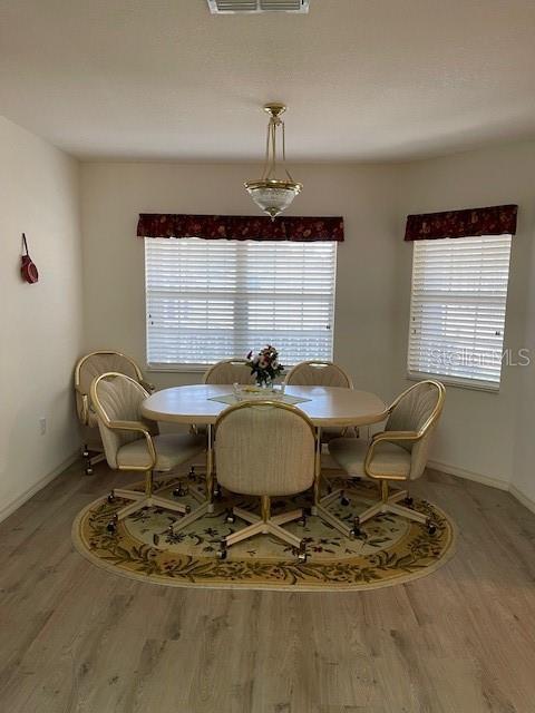 dining space featuring hardwood / wood-style flooring