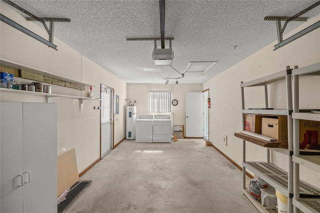 garage featuring water heater, a garage door opener, and washing machine and clothes dryer