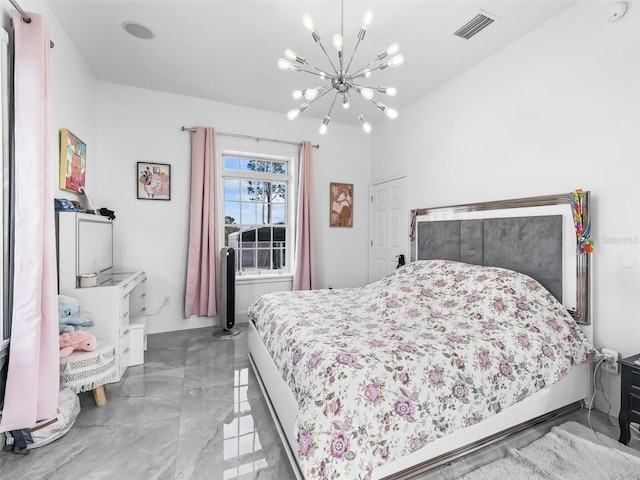 bedroom with a notable chandelier