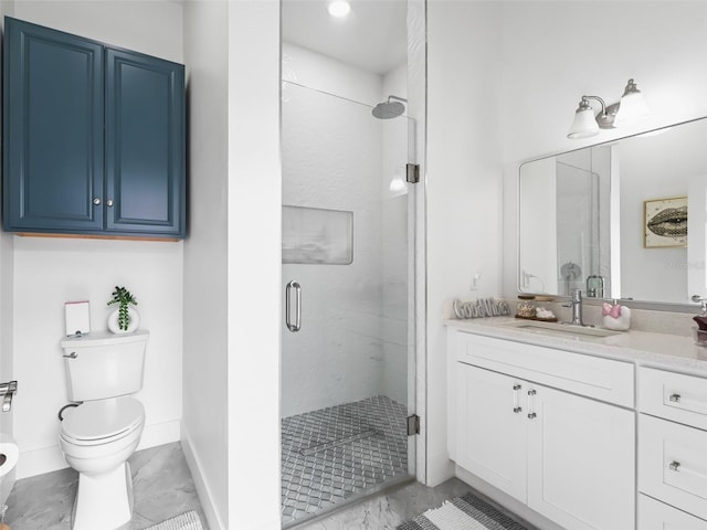 bathroom with vanity, toilet, and an enclosed shower