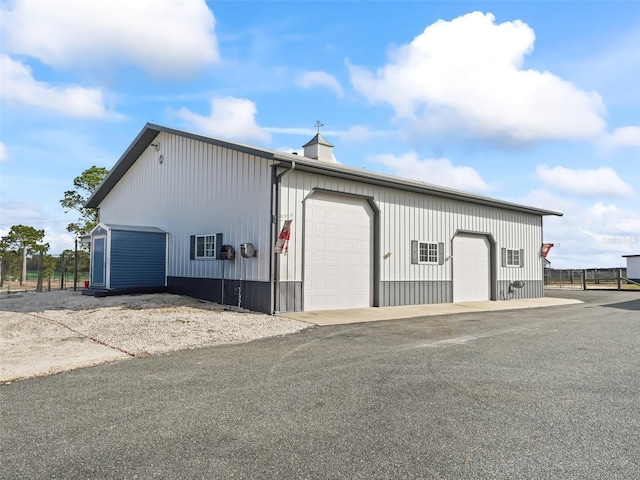 view of outdoor structure featuring a garage