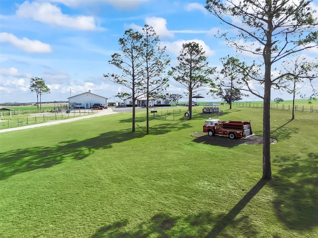 view of property's community with a lawn