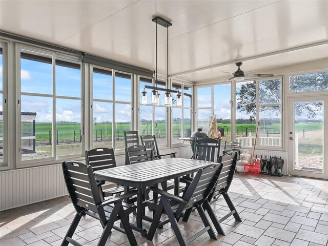 sunroom / solarium featuring stone finish flooring