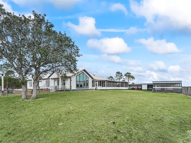 view of yard with a sunroom