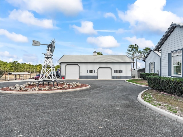 exterior space with an outdoor structure and a garage