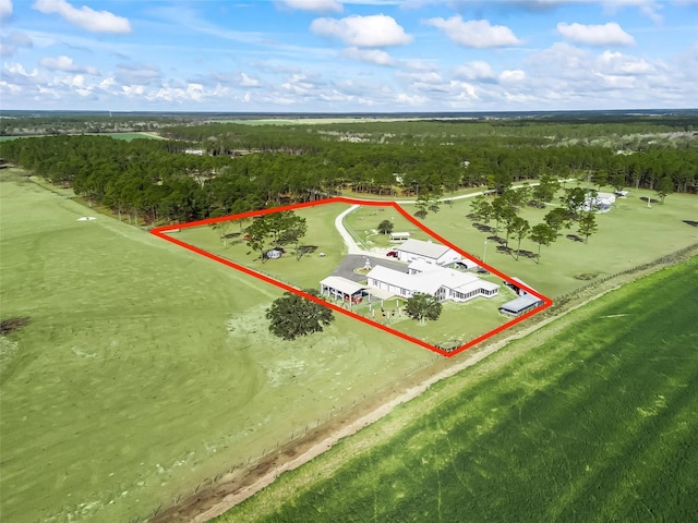 aerial view featuring a wooded view