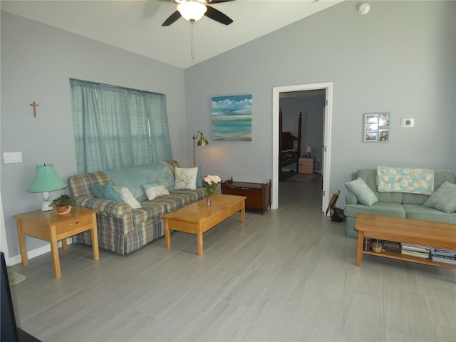 living room featuring ceiling fan and vaulted ceiling