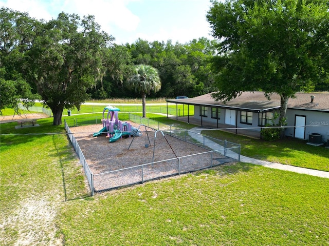 surrounding community featuring a yard and a playground