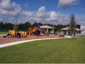 view of jungle gym with a gazebo and a lawn