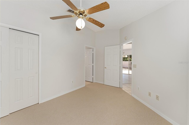 empty room featuring baseboards, visible vents, light colored carpet, and a ceiling fan