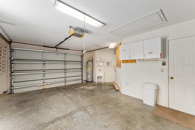 garage with electric water heater, a sink, and a garage door opener