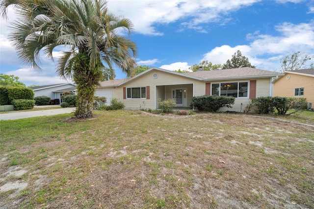 8450 SW 115th Street Rd, Ocala, FL 34481 - single story home with a front lawn, driveway, and a garage