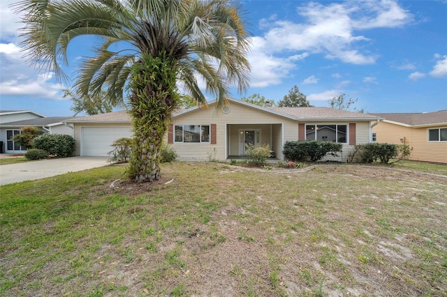 8450 SW 115th Street Rd, Ocala, FL 34481 - ranch-style home with a front lawn, driveway, and a garage