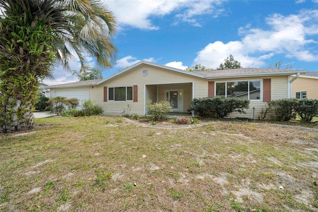 8450 SW 115th Street Rd, Ocala, FL 34481 - ranch-style home with an attached garage and a front lawn