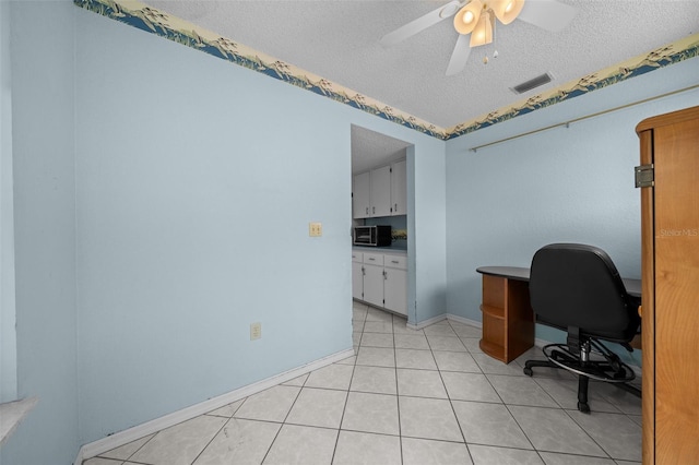 8450 SW 115th Street Rd, Ocala, FL 34481 - office area with a textured ceiling, light tile patterned floors, baseboards, visible vents, and ceiling fan