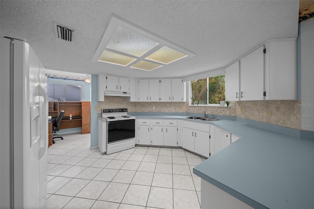 8450 SW 115th Street Rd, Ocala, FL 34481 - kitchen with visible vents, white appliances, under cabinet range hood, white cabinetry, and a sink