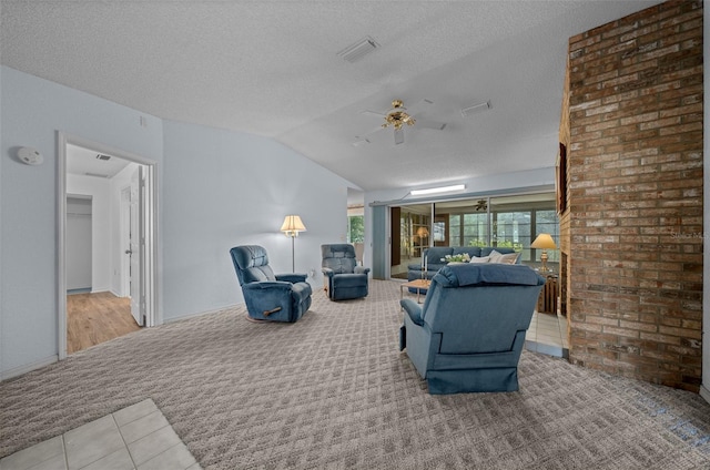 8450 SW 115th Street Rd, Ocala, FL 34481 - living room featuring a textured ceiling, visible vents, carpet, ceiling fan, and lofted ceiling
