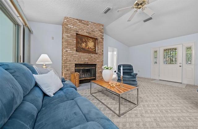 8450 SW 115th Street Rd, Ocala, FL 34481 - carpeted living area with a brick fireplace, visible vents, vaulted ceiling, and ceiling fan