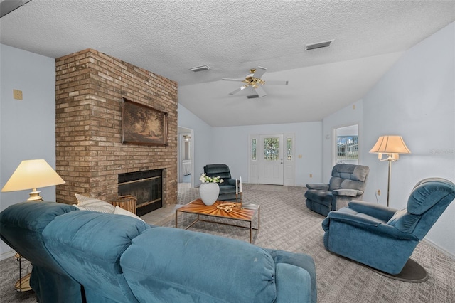 8450 SW 115th Street Rd, Ocala, FL 34481 - carpeted living area with lofted ceiling, a fireplace, visible vents, and ceiling fan