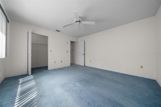 8450 SW 115th Street Rd, Ocala, FL 34481 - unfurnished bedroom featuring a textured ceiling, visible vents, carpet floors, and a ceiling fan
