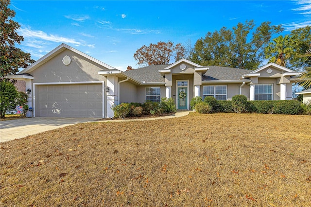 single story home with a garage and a front lawn