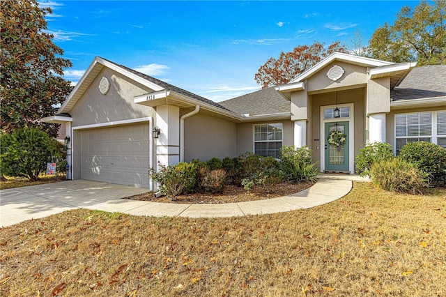 ranch-style home with a garage and a front lawn