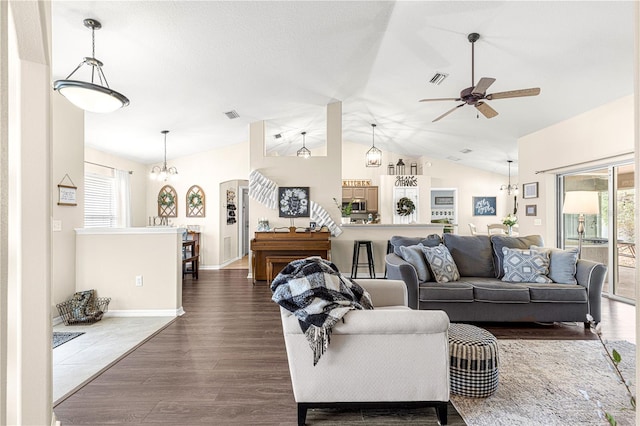 living room featuring ceiling fan, lofted ceiling, and dark hardwood / wood-style floors