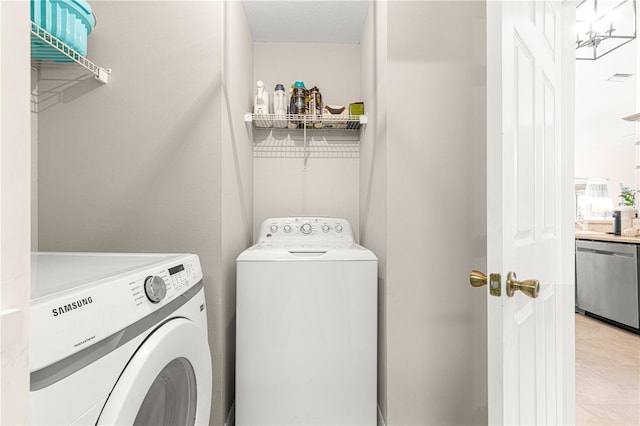 laundry room with washing machine and dryer