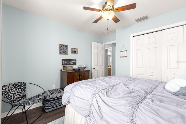 bedroom with ceiling fan, wood-type flooring, and a closet