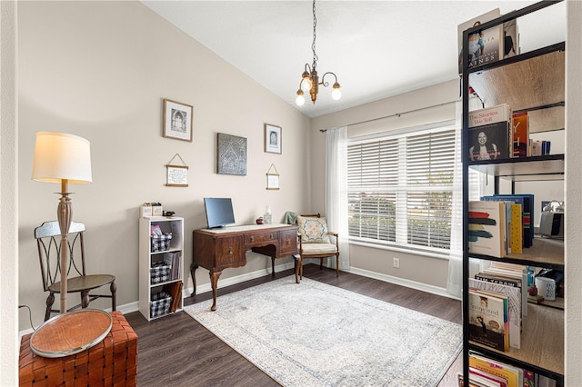 home office featuring lofted ceiling, a notable chandelier, and dark hardwood / wood-style floors