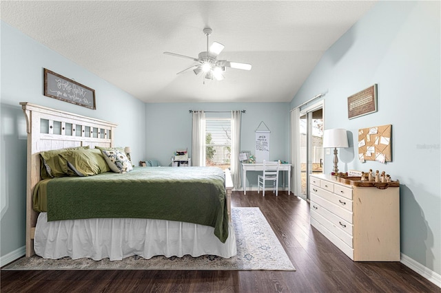 bedroom featuring ceiling fan, lofted ceiling, a textured ceiling, and dark hardwood / wood-style flooring