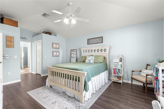 bedroom featuring vaulted ceiling, dark wood-type flooring, ceiling fan, and a closet