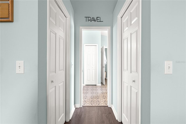 hallway featuring dark wood-type flooring