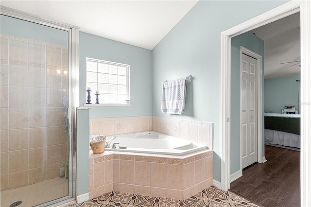 bathroom with shower with separate bathtub and hardwood / wood-style floors