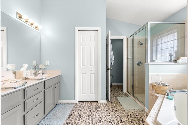 bathroom featuring vanity, shower with separate bathtub, and tile patterned flooring