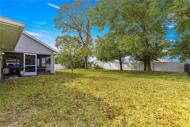 view of yard featuring a sunroom