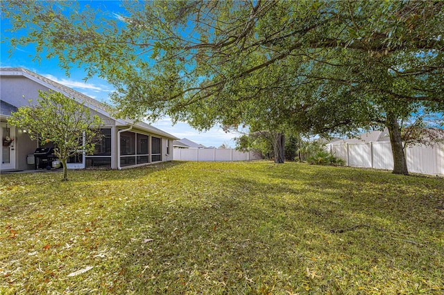 view of yard with a sunroom