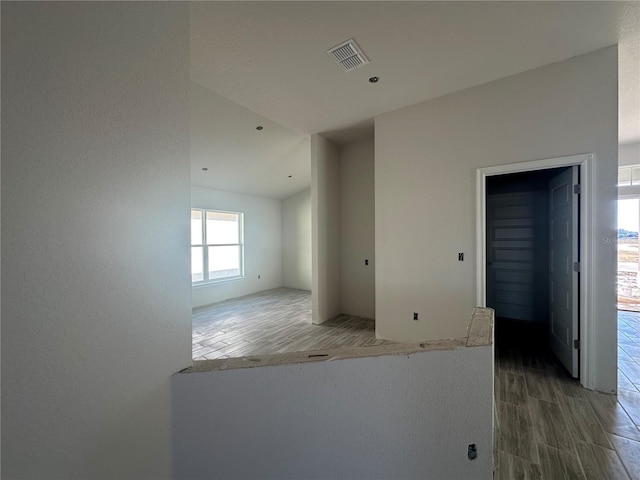 unfurnished room with wood-type flooring