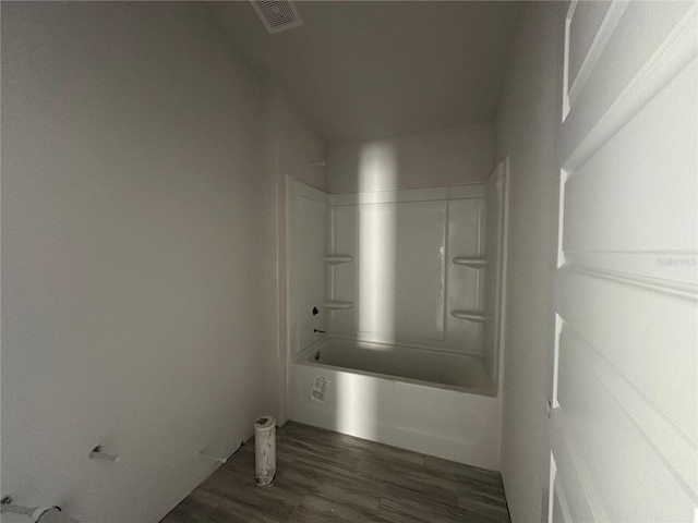 laundry area with dark hardwood / wood-style floors