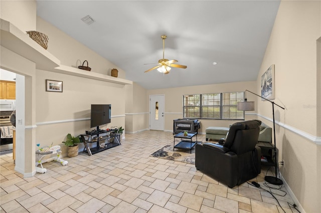 living room with ceiling fan and high vaulted ceiling