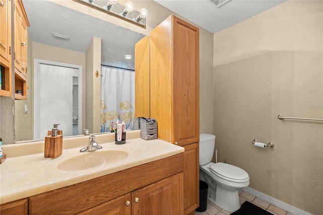 bathroom featuring vanity, a textured ceiling, a shower with curtain, tile patterned floors, and toilet