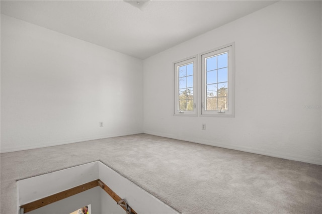 unfurnished room with carpet floors