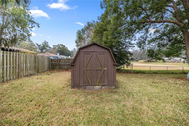 view of outbuilding featuring a lawn