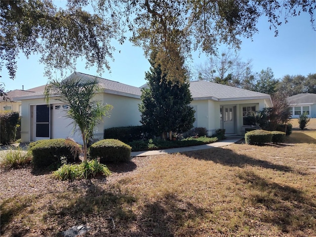 ranch-style home featuring a front yard