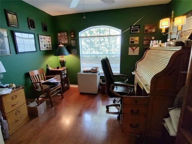 office space with dark wood-type flooring and ceiling fan