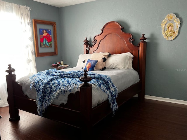 bedroom featuring dark hardwood / wood-style flooring