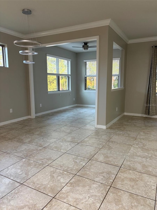 empty room featuring ornamental molding, light tile patterned floors, and an inviting chandelier